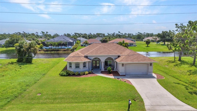 771 Rotonda Cir, Rotonda West, FL 33947 - mediterranean / spanish-style house with an attached garage, french doors, concrete driveway, a front lawn, and a water view