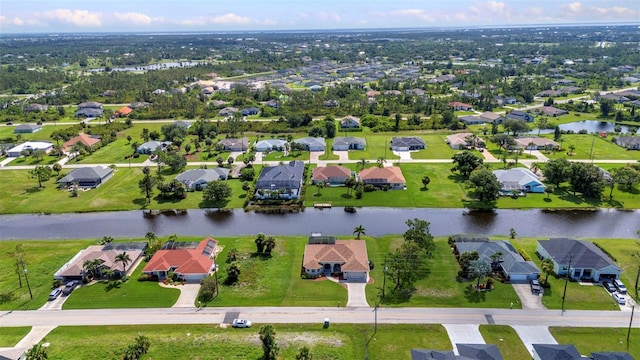 771 Rotonda Cir, Rotonda West, FL 33947 - aerial perspective of suburban area featuring a large body of water