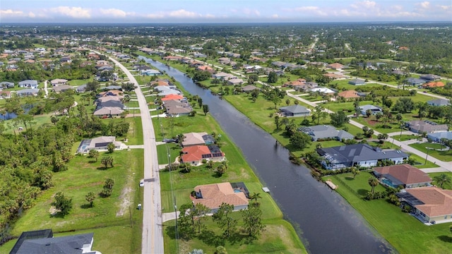 771 Rotonda Cir, Rotonda West, FL 33947 - aerial overview of property's location with nearby suburban area and a large body of water
