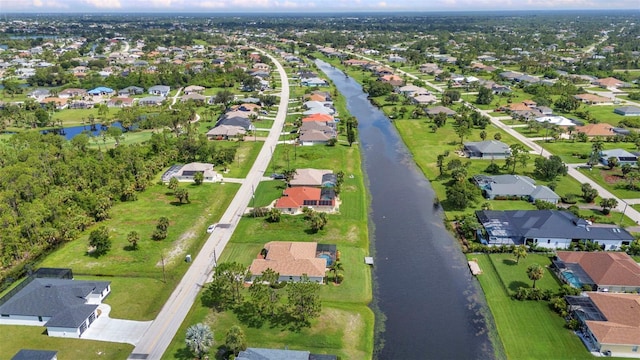 771 Rotonda Cir, Rotonda West, FL 33947 - aerial overview of property's location with nearby suburban area and a large body of water