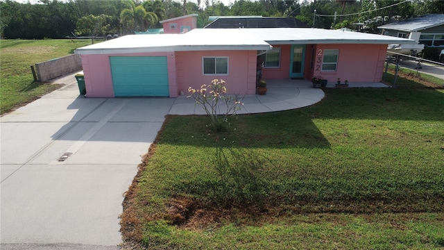 232 Darst Ave, Punta Gorda, FL 33950 - ranch-style house with a garage, driveway, and stucco siding