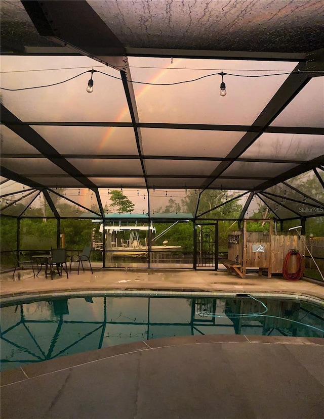 232 Darst Ave, Punta Gorda, FL 33950 - swimming pool with glass enclosure and a patio