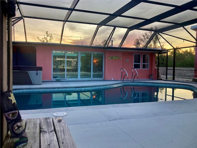 232 Darst Ave, Punta Gorda, FL 33950 - pool at dusk featuring an outdoor pool and a patio area