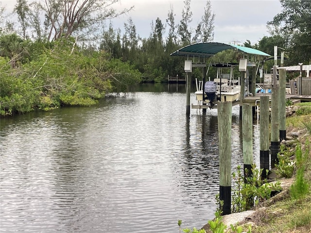 232 Darst Ave, Punta Gorda, FL 33950 - dock featuring boat lift and a water view