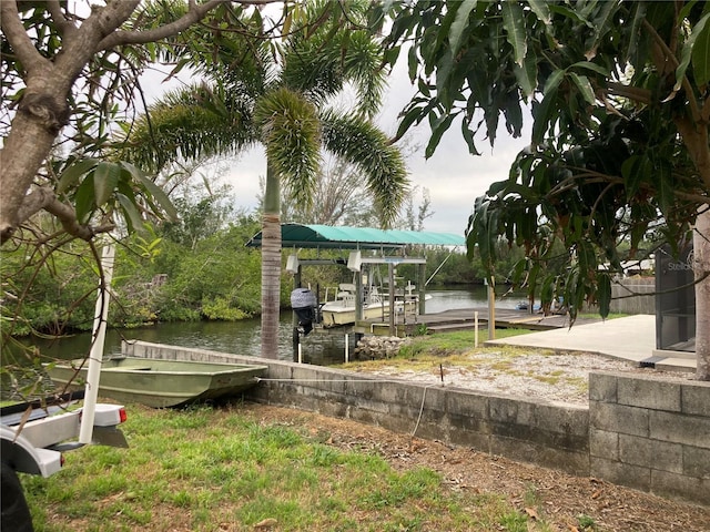 232 Darst Ave, Punta Gorda, FL 33950 - view of yard featuring a dock, a water view, and boat lift
