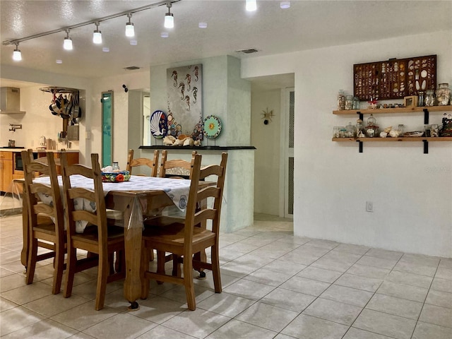 232 Darst Ave, Punta Gorda, FL 33950 - dining room featuring track lighting and light tile patterned floors