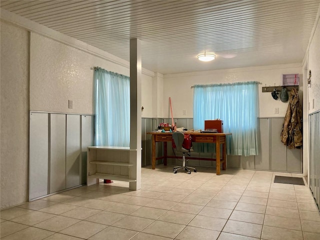 232 Darst Ave, Punta Gorda, FL 33950 - home office featuring tile patterned flooring, a wainscoted wall, a textured wall, and a decorative wall