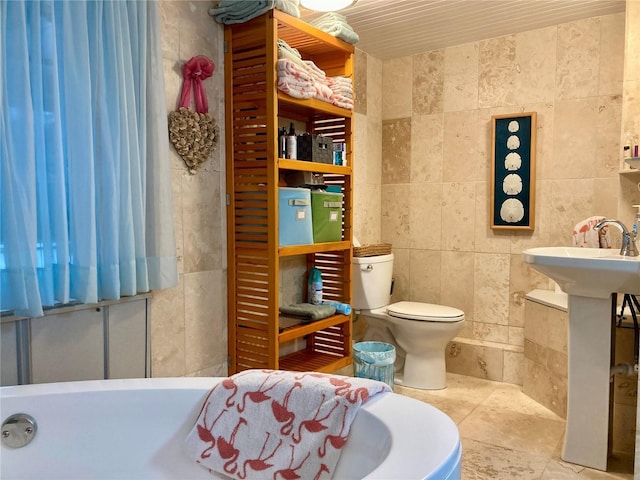 232 Darst Ave, Punta Gorda, FL 33950 - bathroom featuring tile walls and a bath