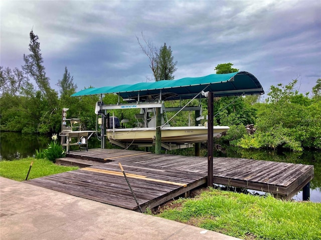 232 Darst Ave, Punta Gorda, FL 33950 - deck with boat lift, a boat dock, and a water view