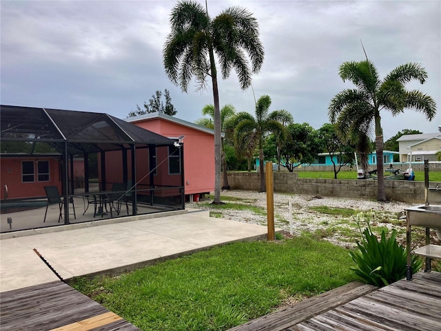 232 Darst Ave, Punta Gorda, FL 33950 - view of yard featuring a patio area and glass enclosure