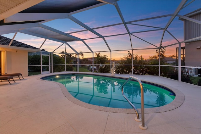 574 Macedonia Dr, Punta Gorda, FL 33950 - pool at dusk featuring an outdoor pool, a patio, and a lanai