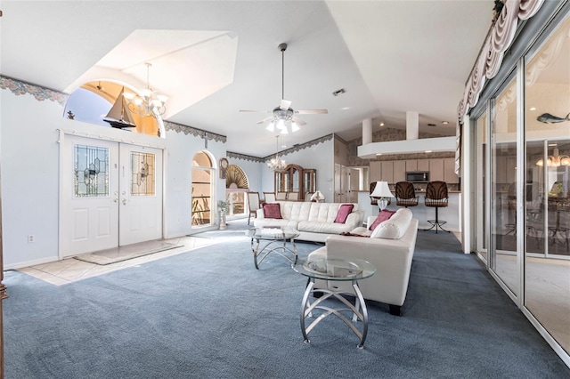 574 Macedonia Dr, Punta Gorda, FL 33950 - carpeted living room featuring lofted ceiling, a ceiling fan, a chandelier, and french doors