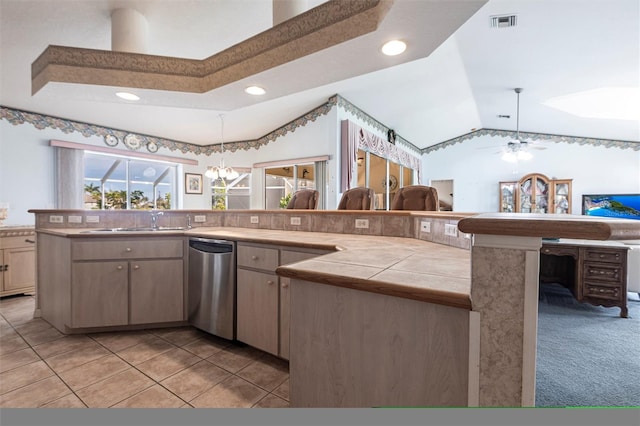 574 Macedonia Dr, Punta Gorda, FL 33950 - kitchen featuring stainless steel dishwasher, vaulted ceiling, pendant lighting, tile countertops, and recessed lighting
