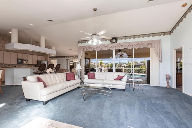 574 Macedonia Dr, Punta Gorda, FL 33950 - carpeted living area with a ceiling fan and high vaulted ceiling