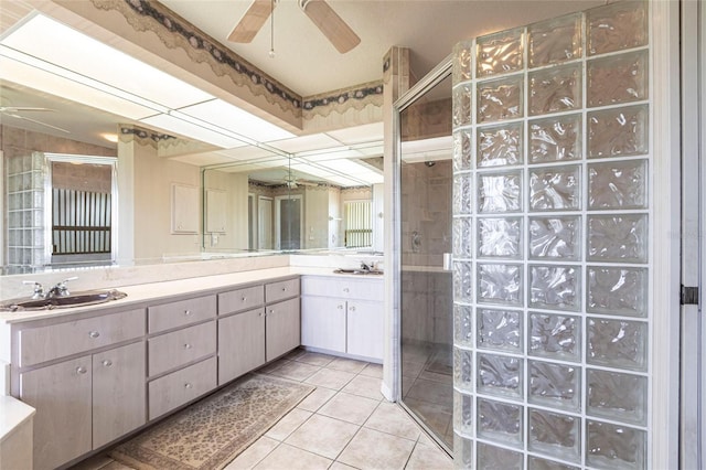 574 Macedonia Dr, Punta Gorda, FL 33950 - bathroom with ceiling fan, a stall shower, double vanity, and tile patterned floors