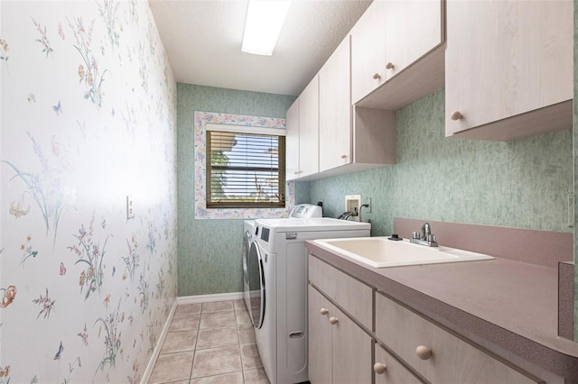 574 Macedonia Dr, Punta Gorda, FL 33950 - laundry room featuring cabinet space, wallpapered walls, washer and dryer, and light tile patterned floors