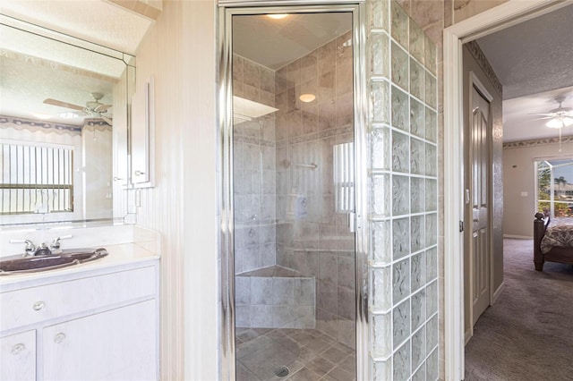 574 Macedonia Dr, Punta Gorda, FL 33950 - ensuite bathroom with a ceiling fan, a textured ceiling, a shower stall, and vanity