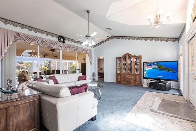 574 Macedonia Dr, Punta Gorda, FL 33950 - carpeted living area with vaulted ceiling, a ceiling fan, and a chandelier