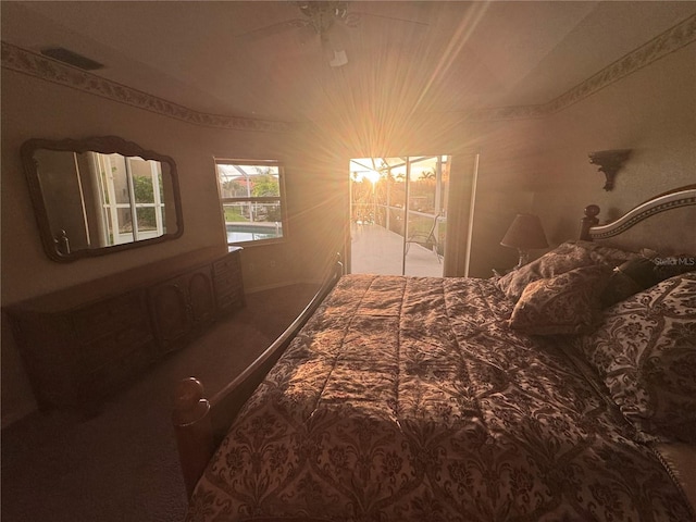 574 Macedonia Dr, Punta Gorda, FL 33950 - carpeted bedroom with a ceiling fan and access to outside