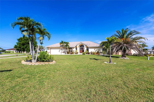 574 Macedonia Dr, Punta Gorda, FL 33950 - ranch-style home featuring a garage and a front lawn