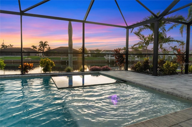 17103 Horizon Ln, Port Charlotte, FL 33948 - swimming pool featuring a patio area, a lanai, and a water view