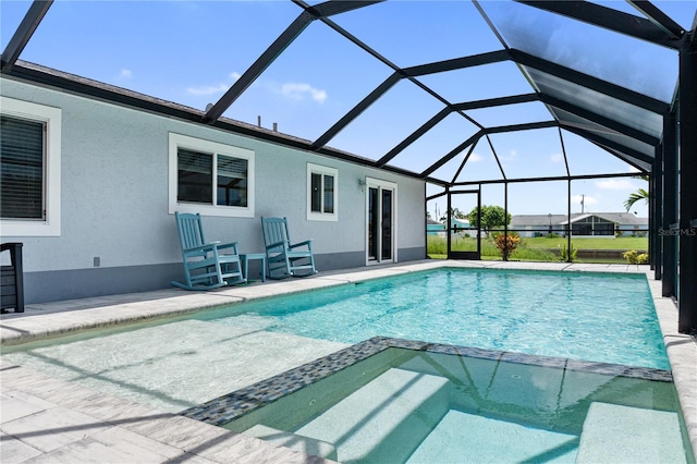 17103 Horizon Ln, Port Charlotte, FL 33948 - view of swimming pool with a pool with connected hot tub, a patio area, and a lanai