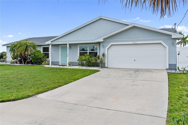 17103 Horizon Ln, Port Charlotte, FL 33948 - single story home with stucco siding, a garage, concrete driveway, and a front lawn