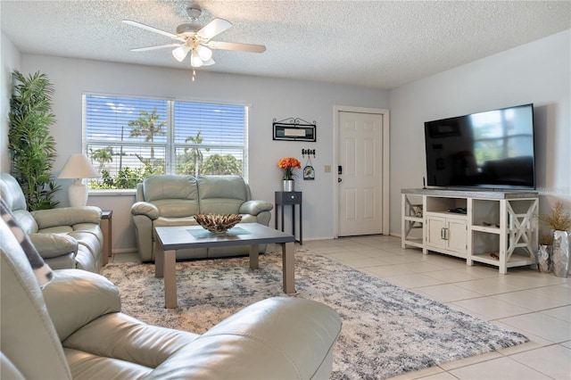 17103 Horizon Ln, Port Charlotte, FL 33948 - living area with ceiling fan, a textured ceiling, and light tile patterned floors