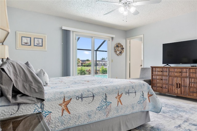 17103 Horizon Ln, Port Charlotte, FL 33948 - bedroom with access to outside, a textured ceiling, and a ceiling fan