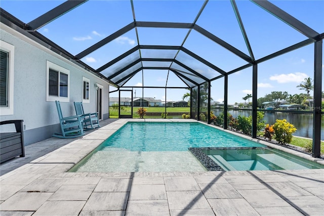 17103 Horizon Ln, Port Charlotte, FL 33948 - view of swimming pool featuring a water view, a patio, a pool with connected hot tub, and glass enclosure