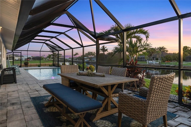 17103 Horizon Ln, Port Charlotte, FL 33948 - view of patio / terrace featuring an outdoor pool, glass enclosure, and a water view