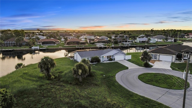 17103 Horizon Ln, Port Charlotte, FL 33948 - aerial view at dusk of a residential view and a water view