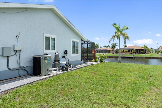 17103 Horizon Ln, Port Charlotte, FL 33948 - view of green lawn with a water view and a lanai
