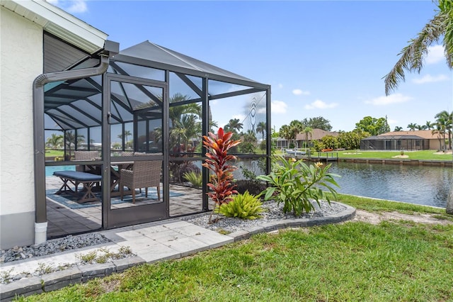 17103 Horizon Ln, Port Charlotte, FL 33948 - entrance to property with stucco siding, a water view, and a patio