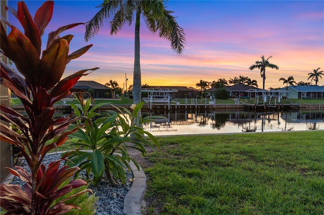 17103 Horizon Ln, Port Charlotte, FL 33948 - view of grassy yard featuring a water view, a dock, and a residential view