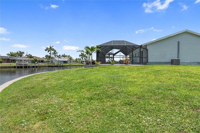 17103 Horizon Ln, Port Charlotte, FL 33948 - view of green lawn featuring a water view and glass enclosure