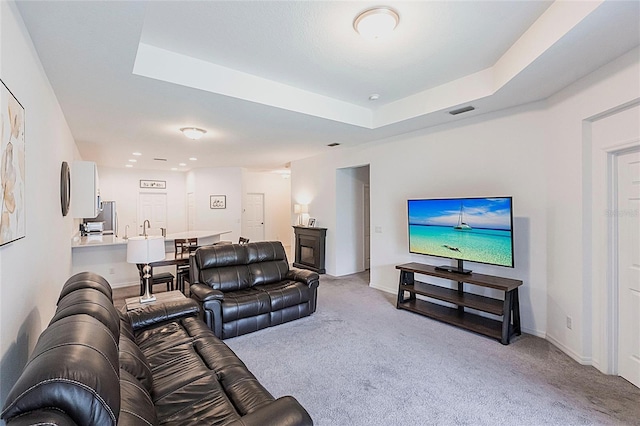 8516 Cache Dr, Sarasota, FL 34240 - living area with light colored carpet and a tray ceiling