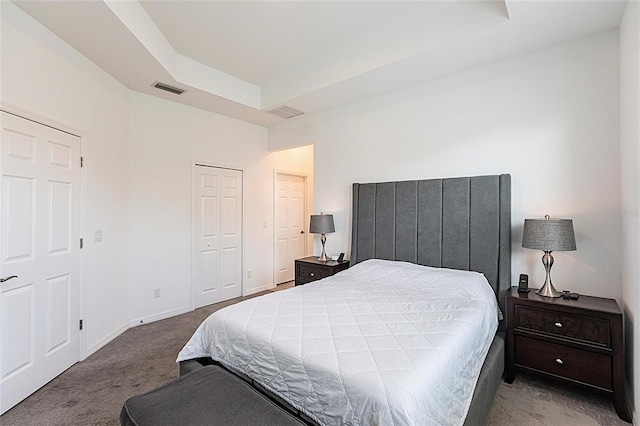 8516 Cache Dr, Sarasota, FL 34240 - carpeted bedroom with a raised ceiling and baseboards