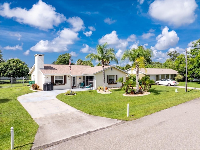 22559 Adorn Ave, Port Charlotte, FL 33952 - ranch-style home with driveway, a chimney, and stucco siding