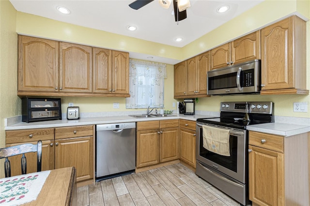 22559 Adorn Ave, Port Charlotte, FL 33952 - kitchen with appliances with stainless steel finishes, light wood-type flooring, light countertops, a ceiling fan, and recessed lighting