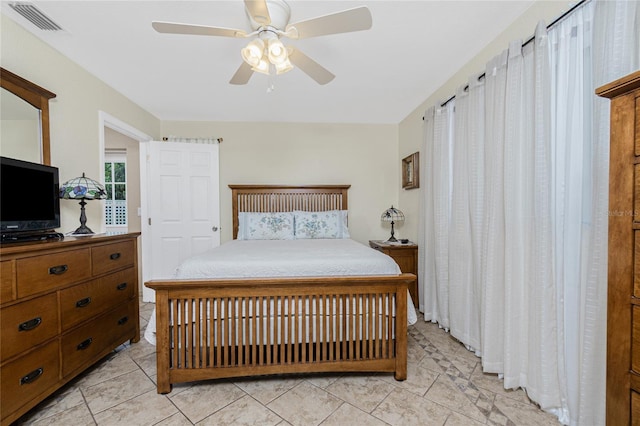 22559 Adorn Ave, Port Charlotte, FL 33952 - bedroom with ceiling fan and light tile patterned flooring