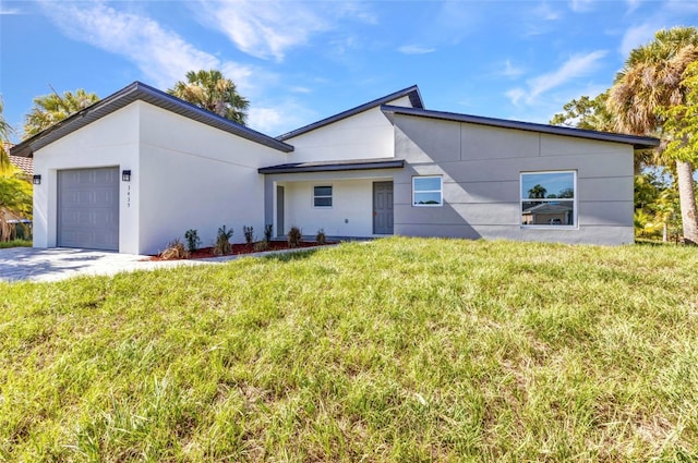 3435 W Price Blvd, North Port, FL 34286 - contemporary home featuring a garage, a front yard, and stucco siding