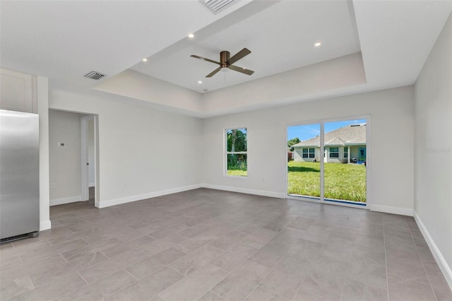 3435 W Price Blvd, North Port, FL 34286 - empty room featuring a tray ceiling, a ceiling fan, and recessed lighting