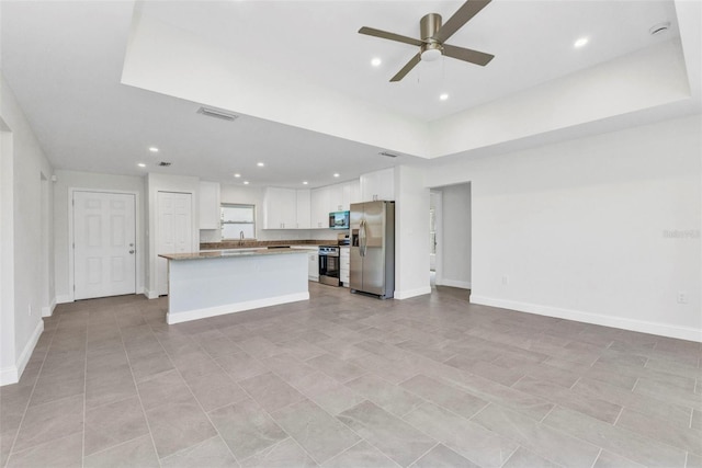 3435 W Price Blvd, North Port, FL 34286 - kitchen with appliances with stainless steel finishes, open floor plan, white cabinets, ceiling fan, and recessed lighting
