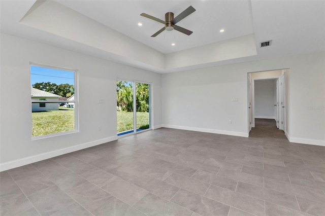 3435 W Price Blvd, North Port, FL 34286 - spare room with a tray ceiling, a ceiling fan, and recessed lighting