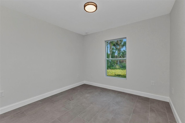 3435 W Price Blvd, North Port, FL 34286 - tiled spare room featuring baseboards