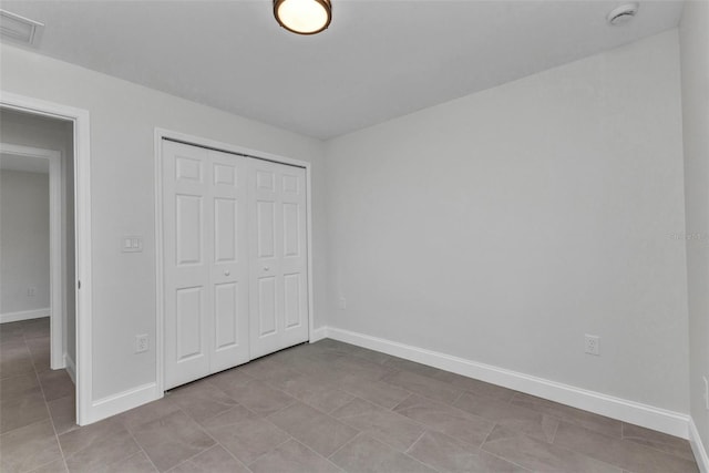 3435 W Price Blvd, North Port, FL 34286 - unfurnished bedroom featuring a closet and tile patterned floors
