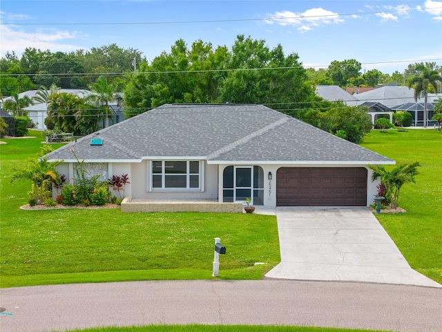 25451 Kowloon Ln, Punta Gorda, FL 33983 - ranch-style house with roof with shingles, stucco siding, a garage, and a front yard