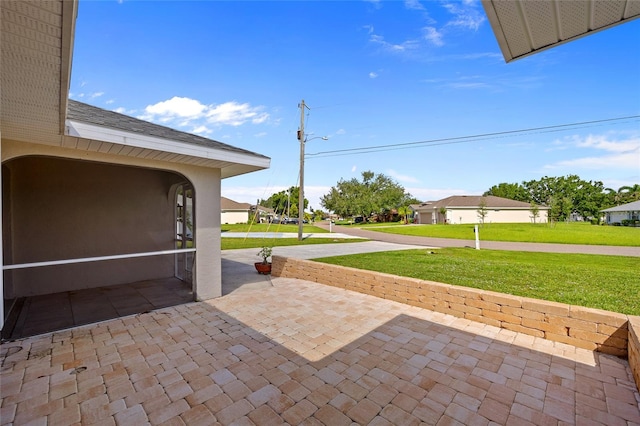25451 Kowloon Ln, Punta Gorda, FL 33983 - view of patio / terrace featuring a residential view