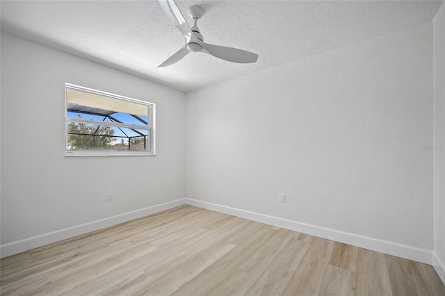 25451 Kowloon Ln, Punta Gorda, FL 33983 - empty room featuring light wood finished floors and a textured ceiling